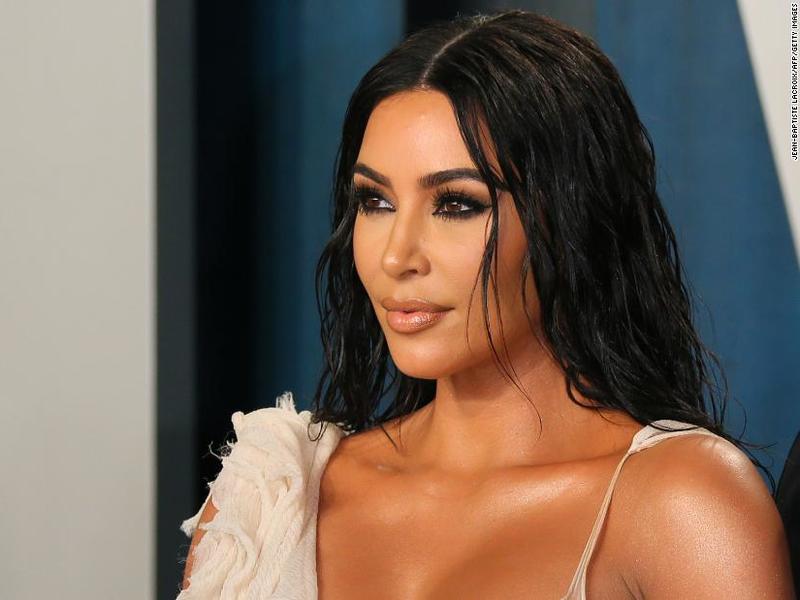Kim Kardashian poses nude with strategically placed pink 